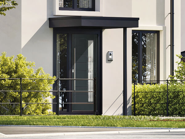 Forte Composite front Door in dark grey set-in matching frame with a single side panel. Long chrome handle and glass.