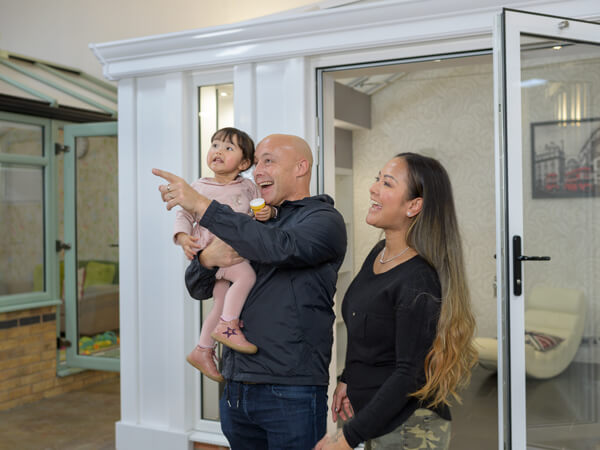 A couple with a young child visiting a 5 star showroom